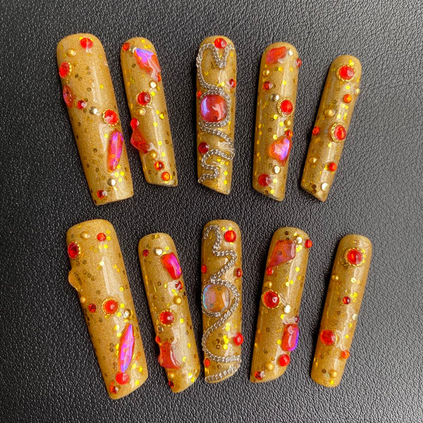 Gold ornate embossed nail art